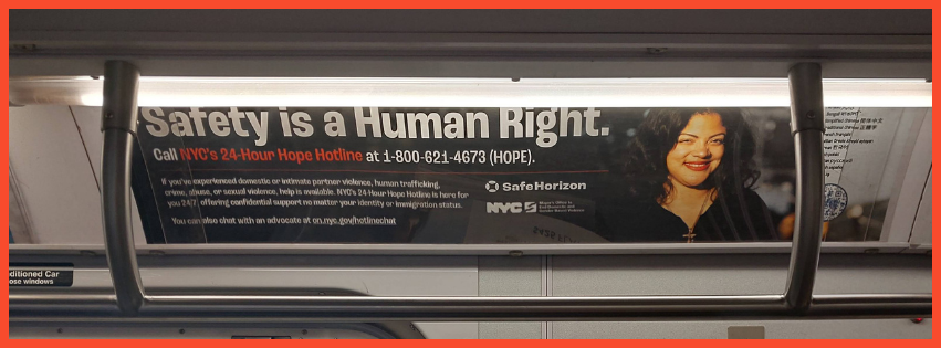 A photo of the Safety is a Human Right ad on a subway